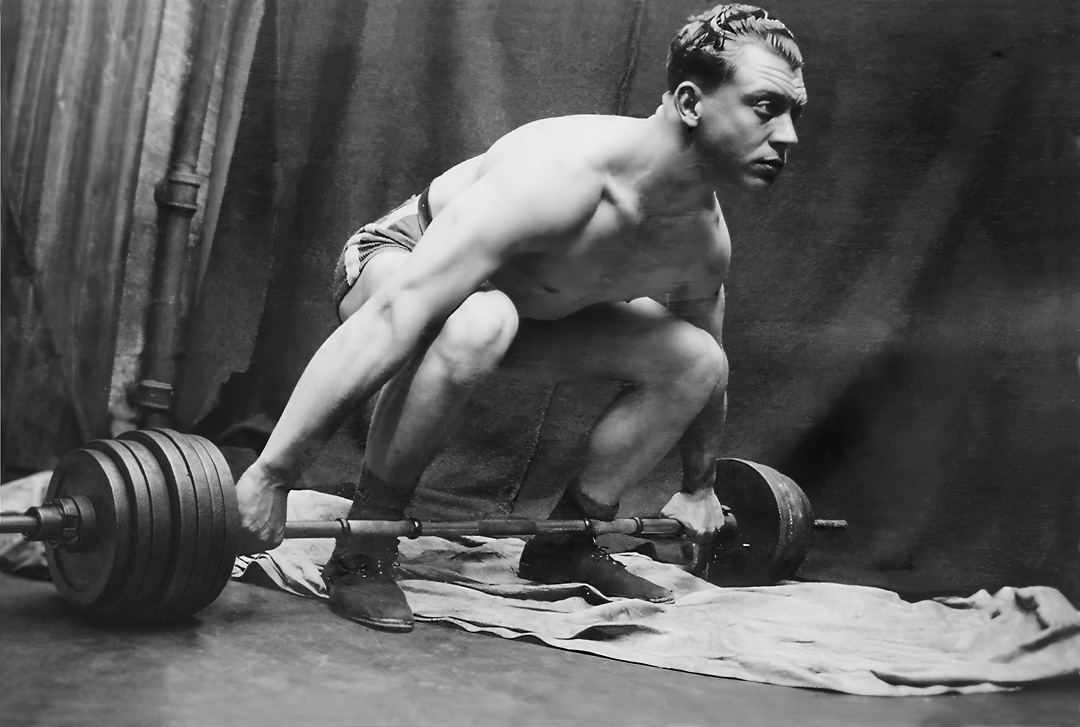 old photo of weight lifter - after restoration