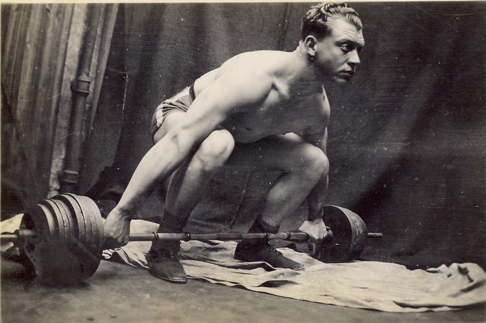 old photo of weight lifter - before restoration