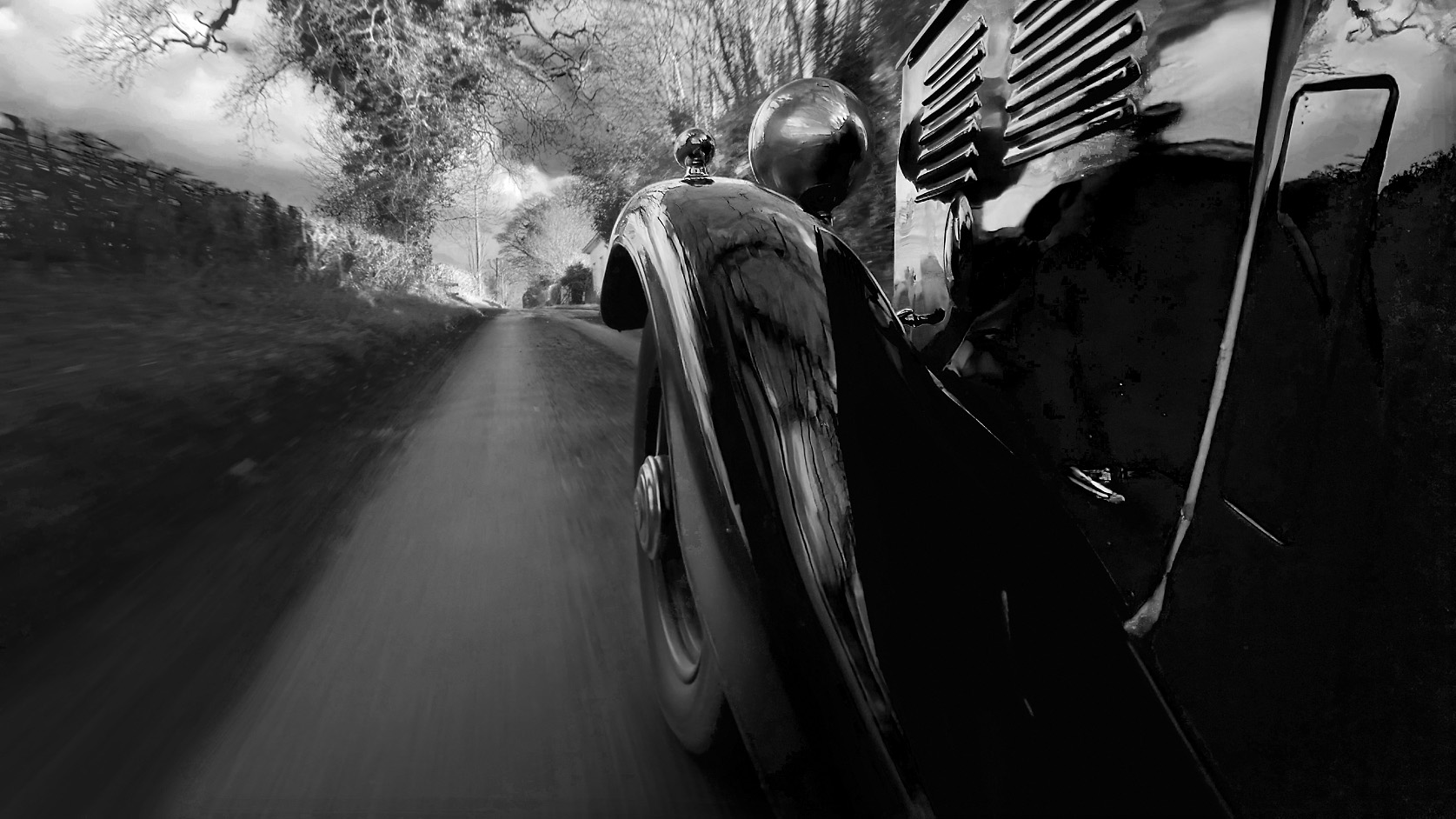 Untitled_1.2.1 fender view of vintage car on country road